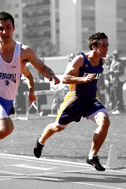 Track athletes sprinting during a race.