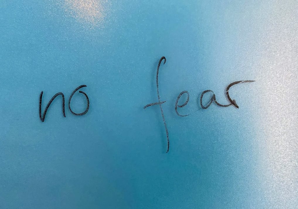 "No fear" written using a whiteboard marker
