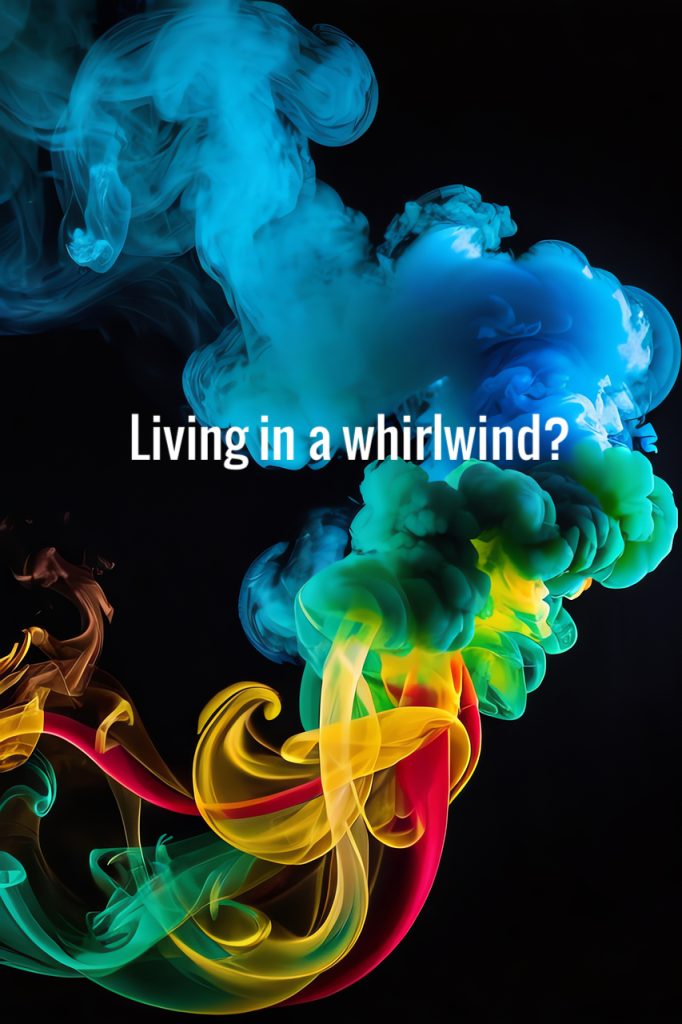 Colorful swirling smoke against black background