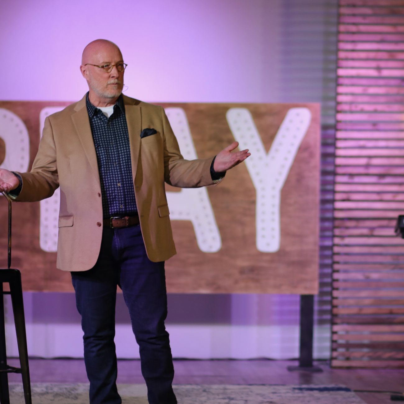 Ray Sanders at a stage empowering executives