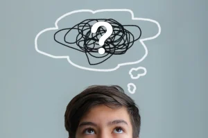Confused person with question mark thought bubble.