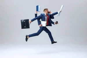 Busy multitasking businessman jumping with documents