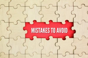 Wooden puzzle with the word Mistakes to Avoid. To keep away from or prevent oneself from making mistakes or blunders.